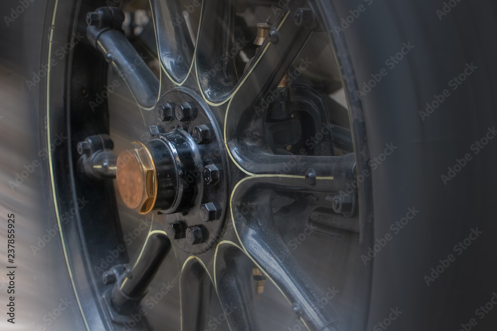 Wheel of retro car with wooden rim, close up. Wheel of retro car with wooden rim, close up.