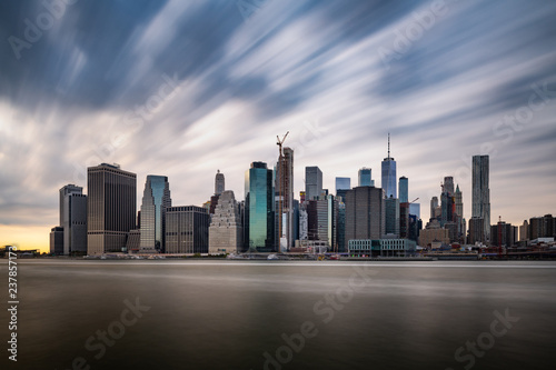 Dark clouds comming quickly over the New York Lower Manhattan during cloudy day in a long exposure panorama photograph