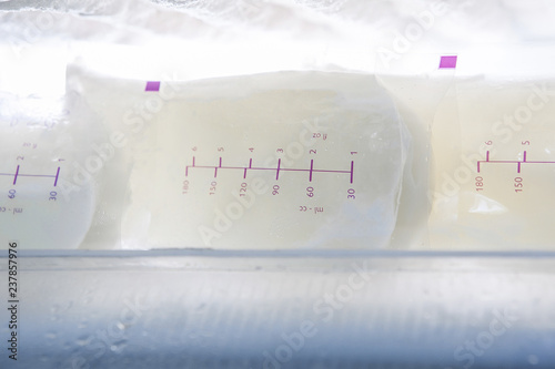 packages with breast milk in freezer photo