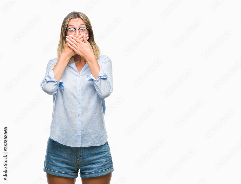 Young beautiful business woman over isolated background shocked covering mouth with hands for mistake. Secret concept. Young beautiful business woman over isolated background shocked covering mouth with hands for mistake. Secret concept.
