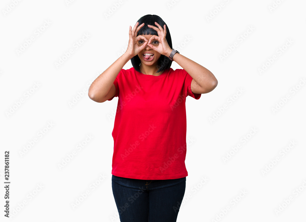 Beautiful young african american woman wearing glasses over isolated background doing ok gesture like binoculars sticking tongue out, eyes looking through fingers. Crazy expression. Beautiful young african american woman wearing glasses over isolated background doing ok gesture like binoculars sticking tongue out, eyes looking through fingers. Crazy expression.