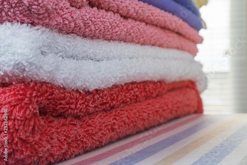 Stack of clean multi colored terry towels © Dmitry