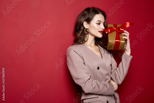 Sexy pretty lady fashion model beautiful woman wear style dress celebration happy holidays merry Christmas Eve New Year party hold gift box present surprise brunette makeup St. Valentine's Day.