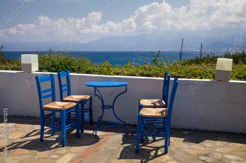 Blue chairs and tables in the restaurant. A place to eat on the seashore. © Szymon Kaczmarczyk