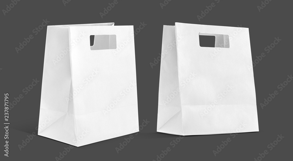 White shopping paper bag isolated on gray background White shopping paper bag isolated on gray background
