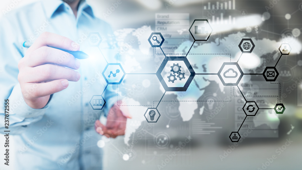 Automation and smart industry 4.0, Internet of things (IOT), Gears and system structure on virtual screen. Business and technology concept. Automation and smart industry 4.0, Internet of things (IOT), Gears and system structure on virtual screen. Business and technology concept.