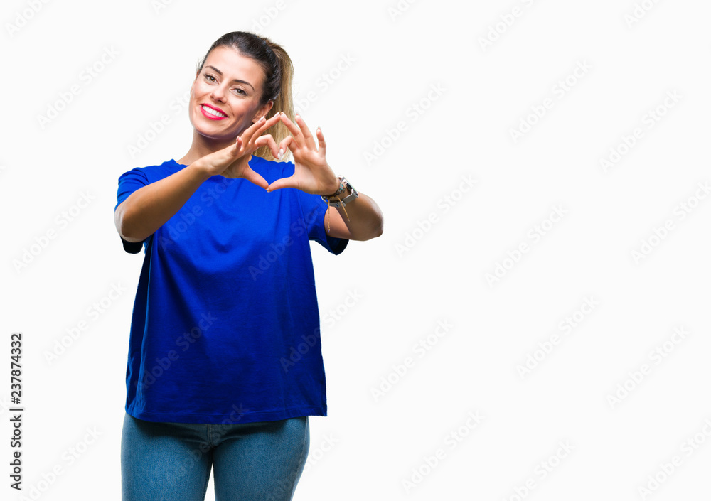 Young beautiful woman wearing casual blue t-shirt over isolated background smiling in love showing heart symbol and shape with hands. Romantic concept. Young beautiful woman wearing casual blue t-shirt over isolated background smiling in love showing heart symbol and shape with hands. Romantic concept.