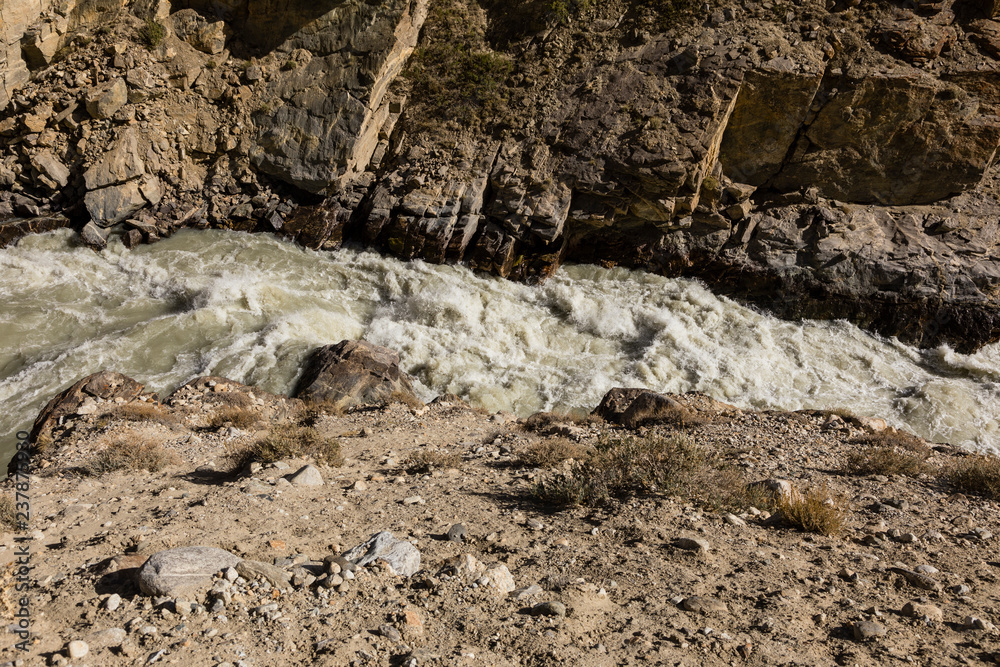 Pamir River in the Pamir Mountains on the border between Tajikistan (below) and Afghanistan (above) Pamir River in the Pamir Mountains on the border between Tajikistan (below) and Afghanistan (above)