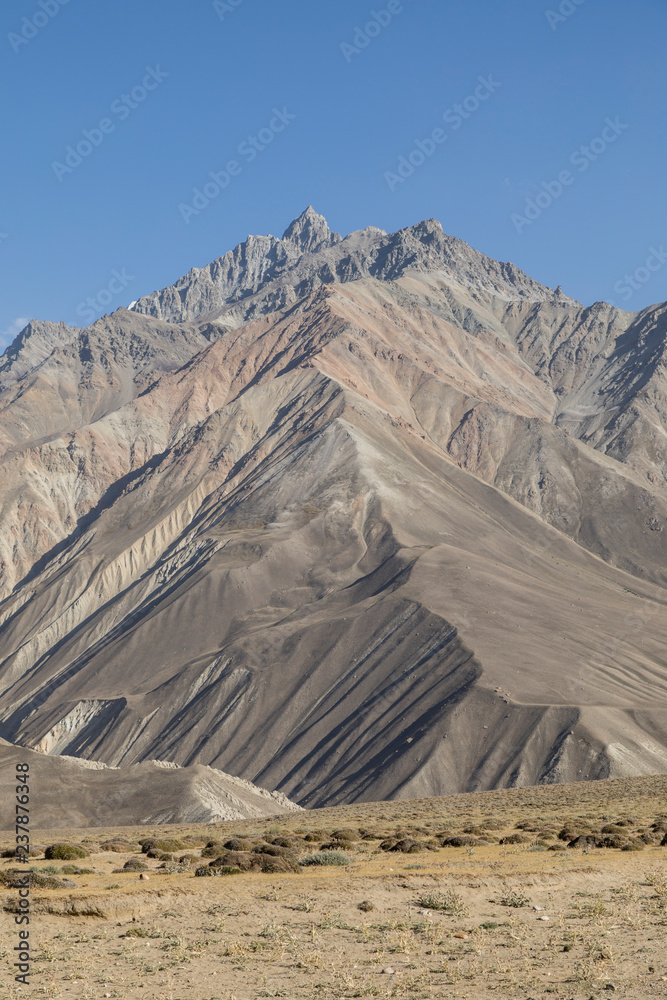 Beautiful landscape in the Pamir mountains. View from Tajikistan towards Afghanistan in the background with the mountain peaks
