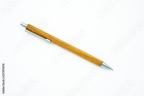Mechanical pencil on white notebook isolated on white background. Selective focus.