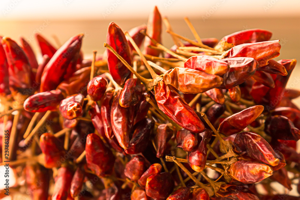 Fototapeta premium mini hot chili pods dried sun whole fruits a lot pile design design menu close-up background base of smoked paprika