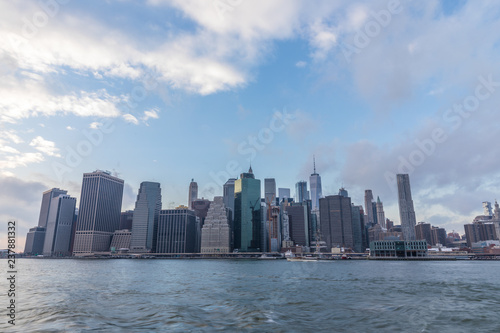 View of Manhattan at sunset from the side of the pier. © A_Skorobogatova
