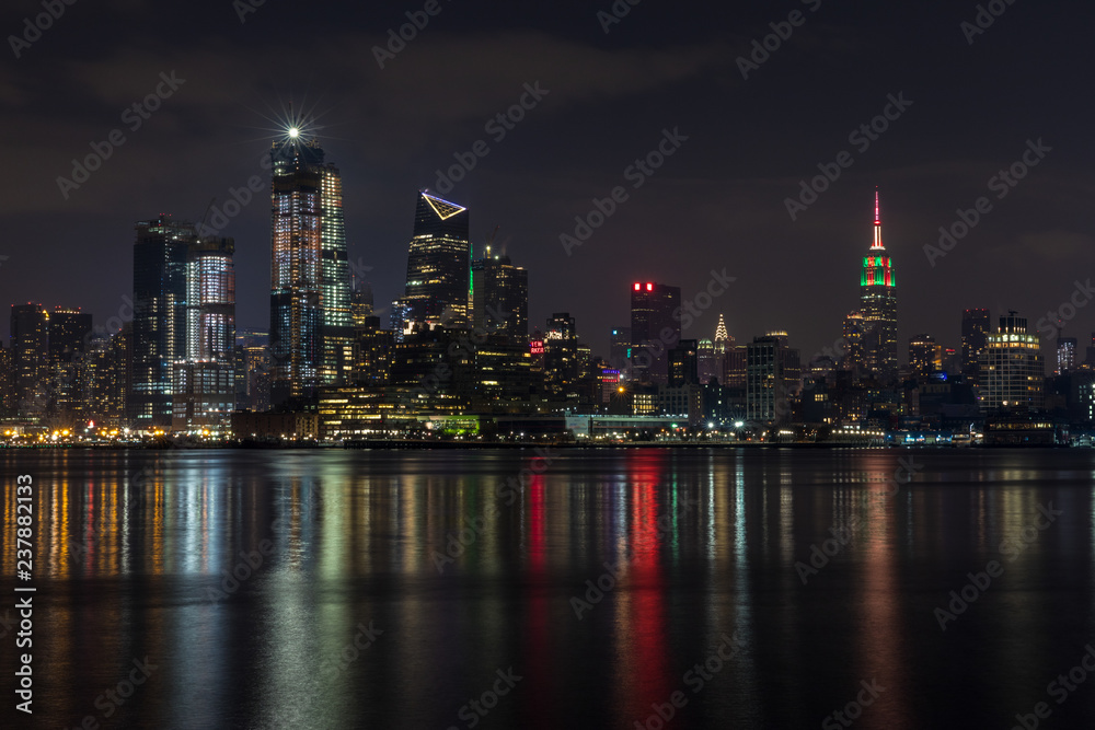 Fototapeta premium Manhattan skyline panorama with Times Square lights at dusk, New York City