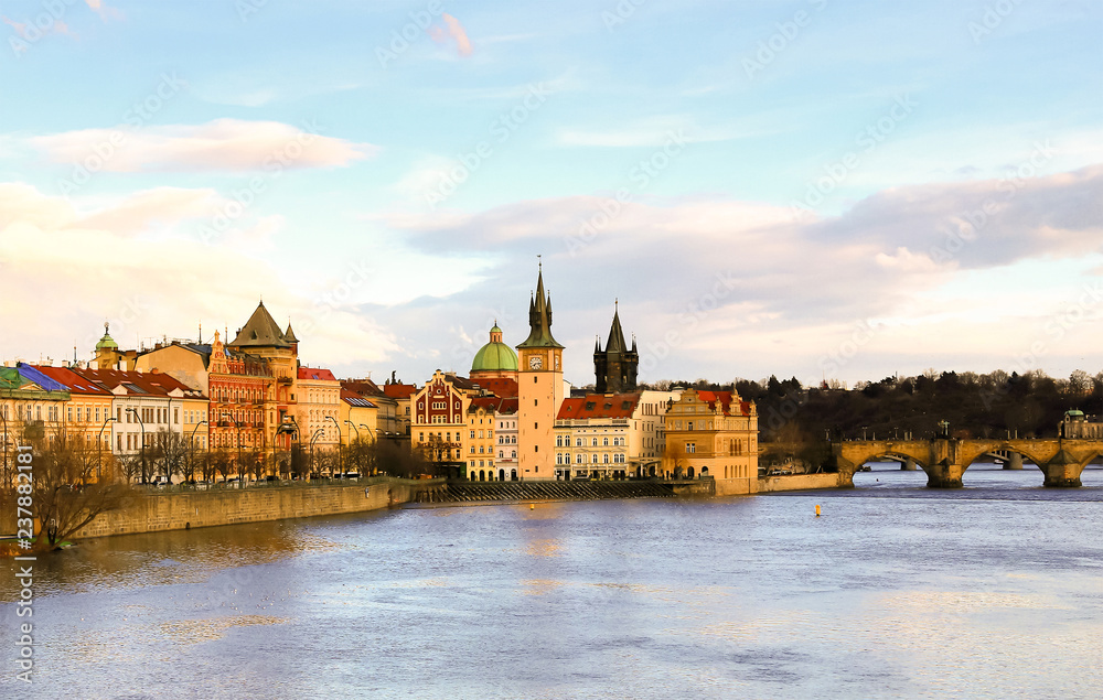 panoramic view of the tower with a clock on the river vatslav mala strana part of the stone bridge. Prague Czech Republic March 2017