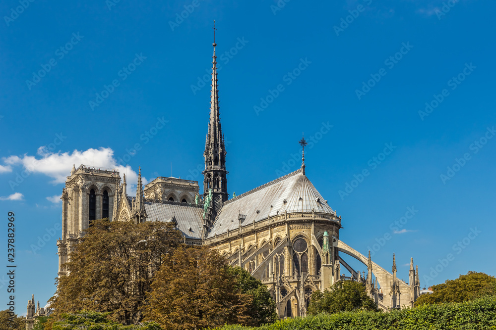 Notre Dame Cathedral, Paris, France, against a blue sky.