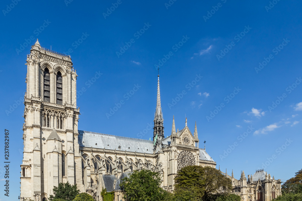Notre Dame Cathedral, Paris, France, against a blue sky. Notre Dame Cathedral, Paris, France, against a blue sky.
