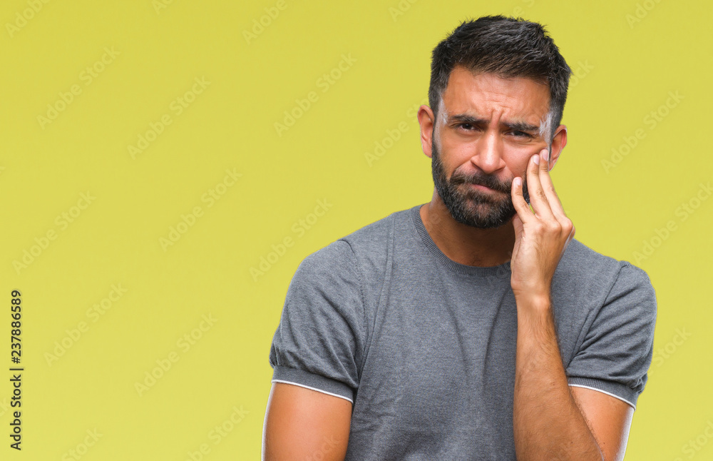 Adult hispanic man over isolated background thinking looking tired and bored with depression problems with crossed arms.
