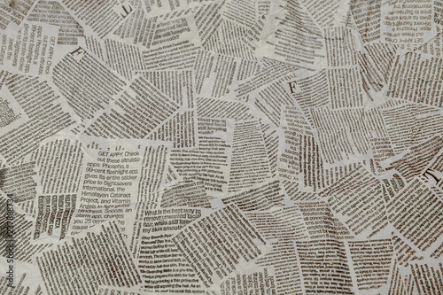 Black and white repeating torn newspaper background. Continuous pattern left, right, up and down
