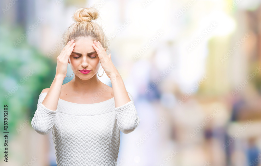 Young beautiful blonde and blue eyes woman over isolated background with hand on head for pain in head because stress. Suffering migraine.