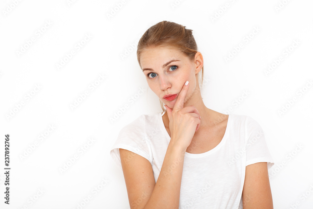 Image of European female with clueless expressions, doubts what to eat delicious for supper, isolated over white background. What to choose? Image of European female with clueless expressions, doubts what to eat delicious for supper, isolated over white background. What to choose?