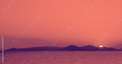 Trend photography on the theme of the color of the year Panton 2019 - Living Coral. Summer landscape with a view of sea at sunset photo