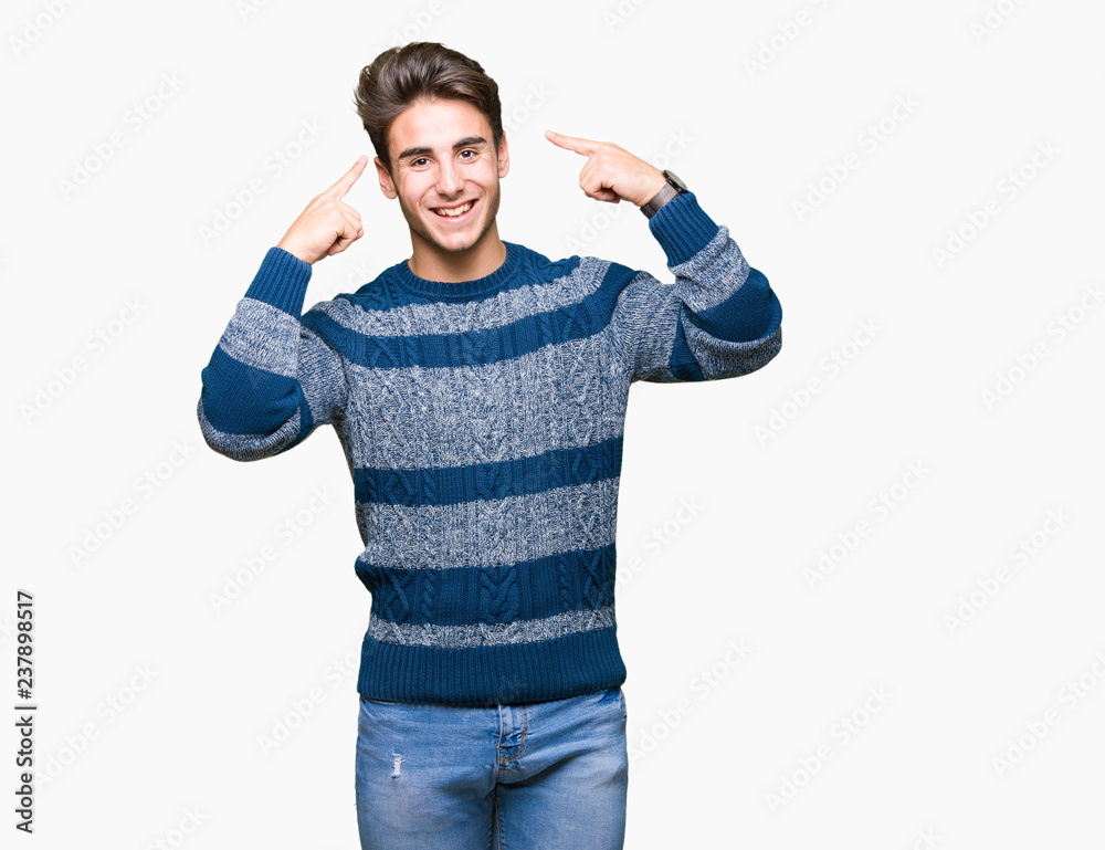 Young handsome man over isolated background Smiling pointing to head with both hands finger, great idea or thought, good memory Young handsome man over isolated background Smiling pointing to head with both hands finger, great idea or thought, good memory