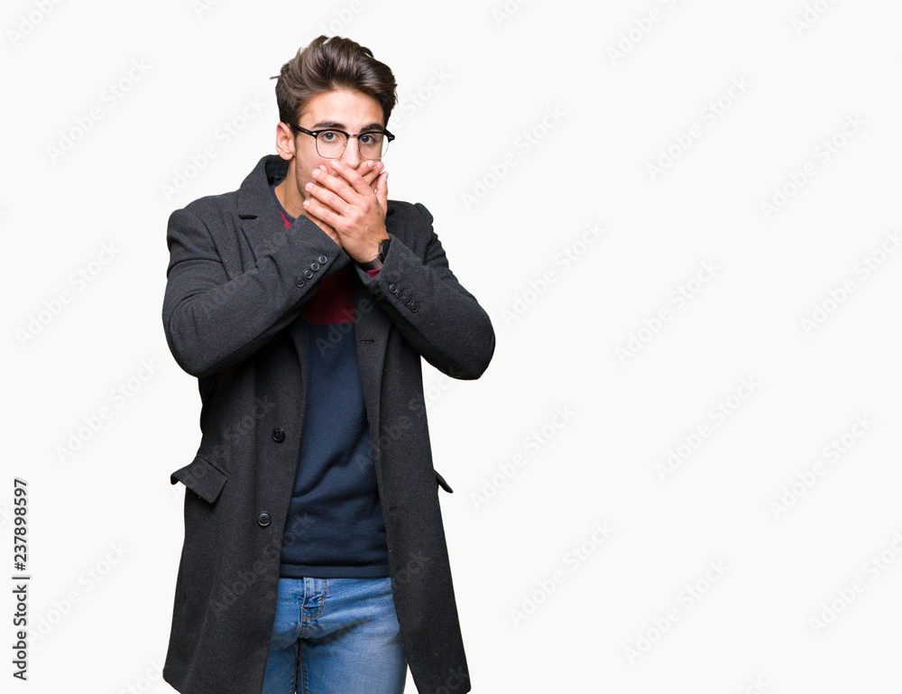 Young handsome elegant man wearing glasses over isolated background shocked covering mouth with hands for mistake. Secret concept. Young handsome elegant man wearing glasses over isolated background shocked covering mouth with hands for mistake. Secret concept.