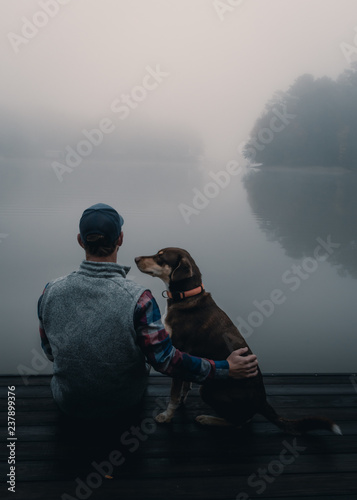 Man and dog on dock