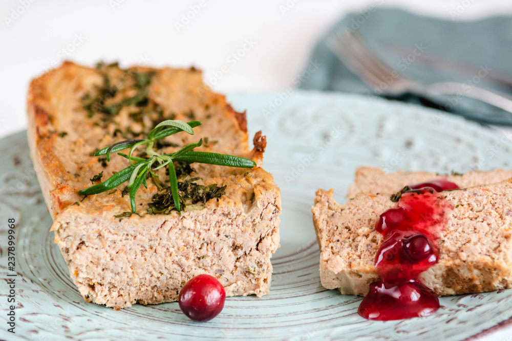 Chicken and liver pate with cranberry sauce, served on plate. Chicken and liver pate with cranberry sauce, served on plate.