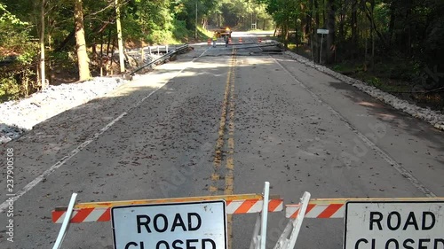 Washed out bridge across Hammer Creek in Lancaster County, Pennsylvania, pavement destroyed by water after torrential rain and downpour, natural disaster photo