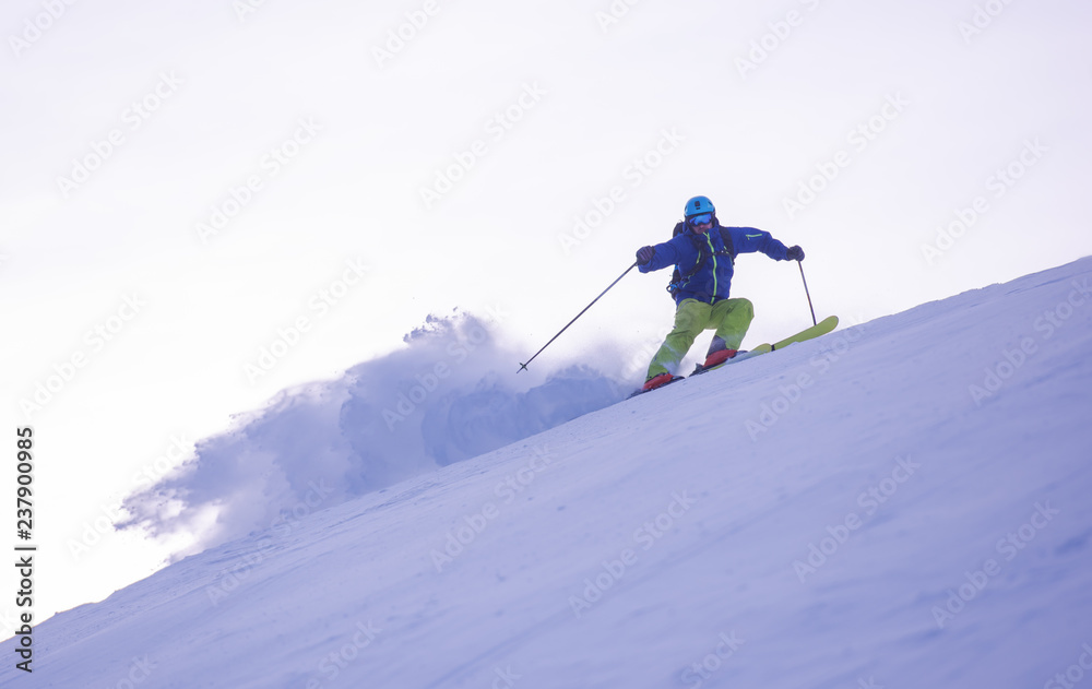 Skier having fun while running downhill Skier having fun while running downhill