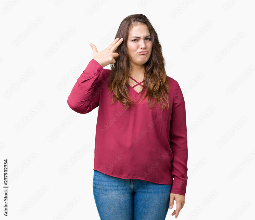 Beautiful plus size young woman over isolated background Shooting and killing oneself pointing hand and fingers to head, suicide gesture. Beautiful plus size young woman over isolated background Shooting and killing oneself pointing hand and fingers to head, suicide gesture.