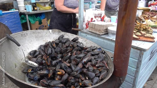 Kherson, Ukraine - 27th of May, 2017:  4K KhersON Food Festival - Mussels cooked in shell and other seafood for sale photo