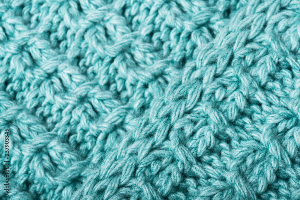 Mint knitted fabric texture closeup. Can be used as a background. Selective focus Mint knitted fabric texture closeup. Can be used as a background. Selective focus