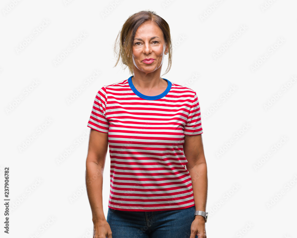 Middle age senior hispanic woman over isolated background with a happy and cool smile on face. Lucky person. Middle age senior hispanic woman over isolated background with a happy and cool smile on face. Lucky person.