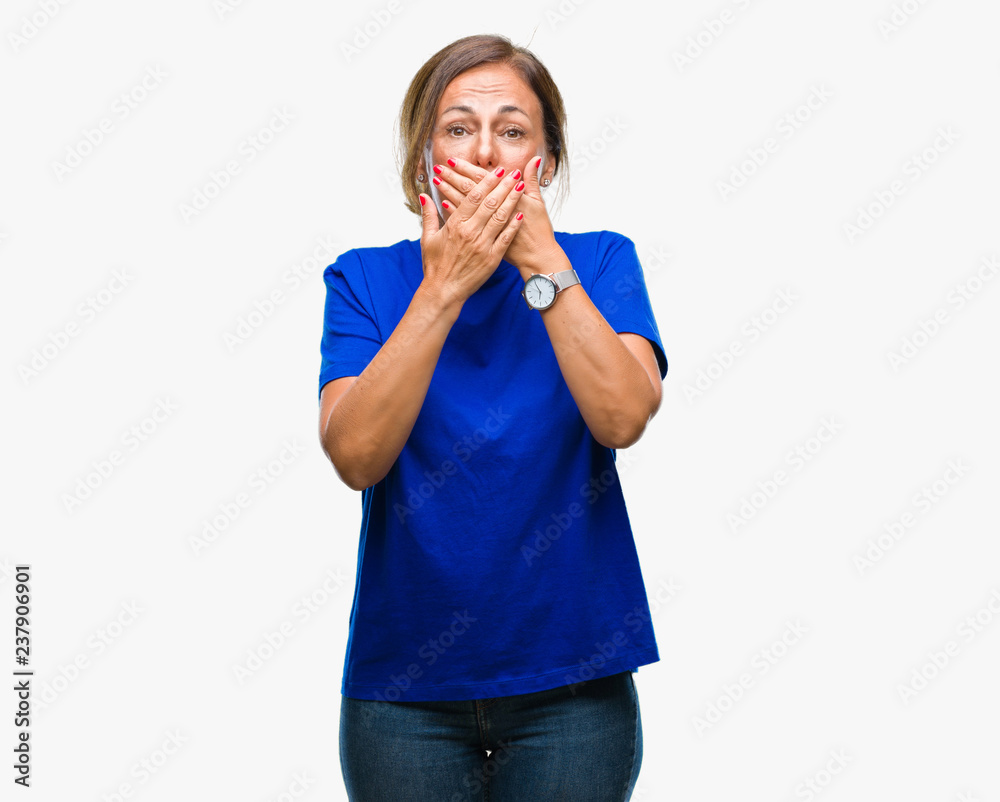 Middle age senior hispanic woman over isolated background shocked covering mouth with hands for mistake. Secret concept. Middle age senior hispanic woman over isolated background shocked covering mouth with hands for mistake. Secret concept.