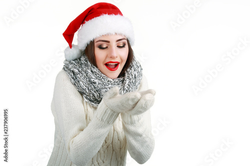Beautiful smiling female model wear santa hat