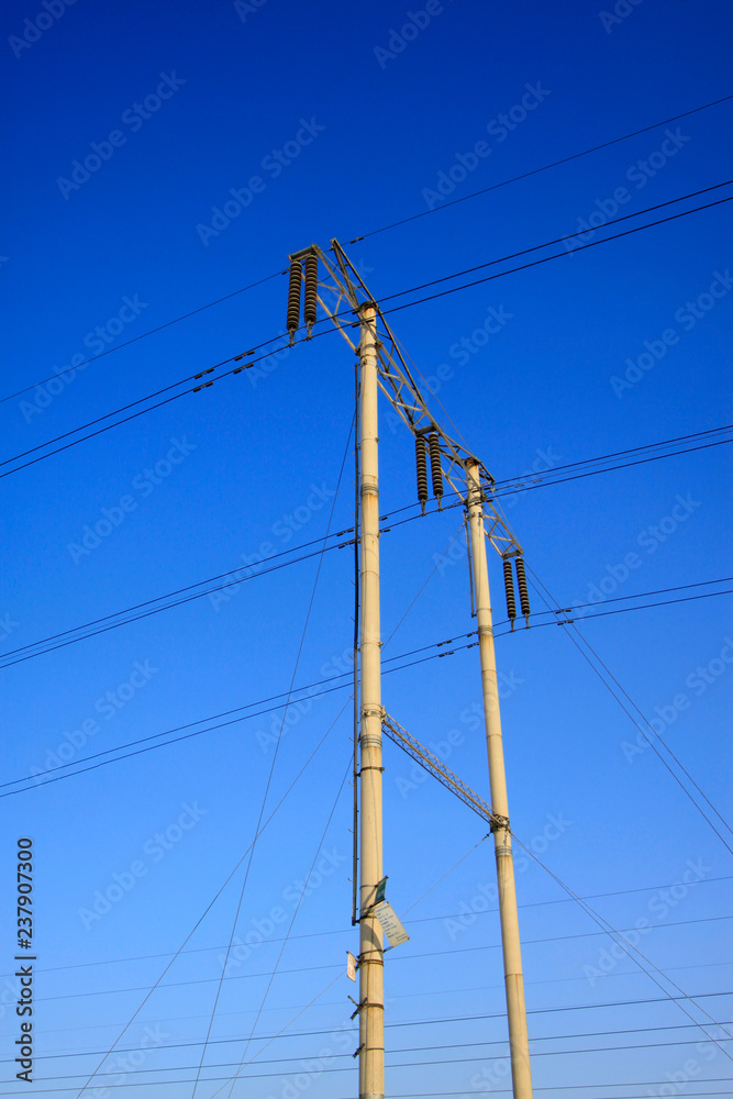 telegraph poles in the blue sky background