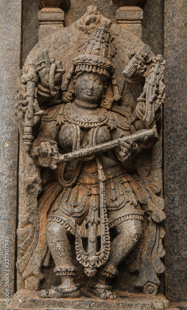 Artistic stone sculptures and carvings of Hindu Gods & Goddesses at Somanathapura Temple in Karnataka, India. 