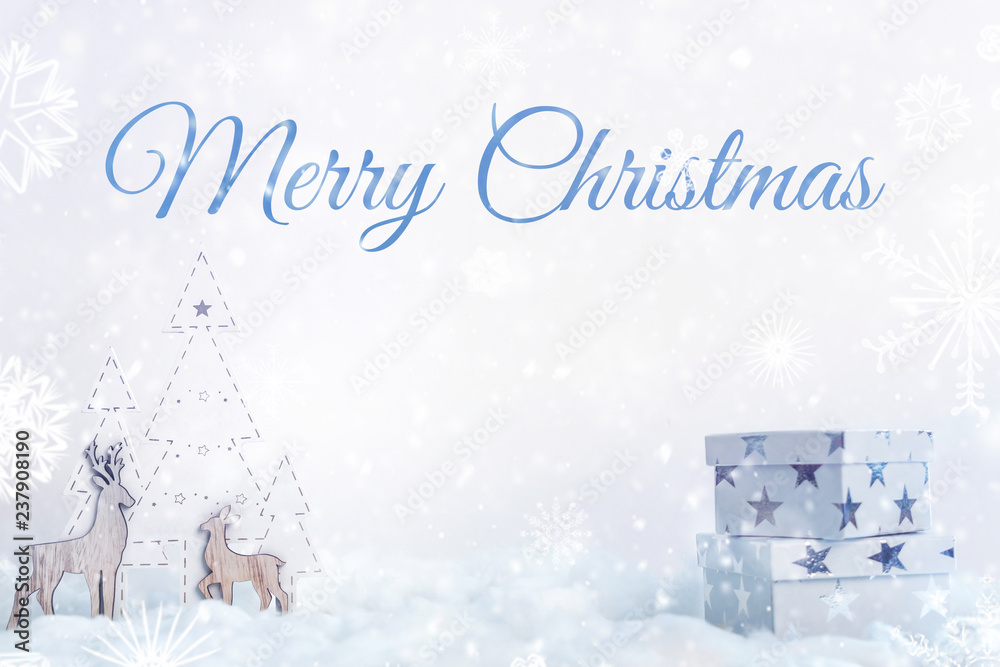 White Christmas card with white presents in stars, snow, a wooden Christmas tree and Merry Christmas inscription