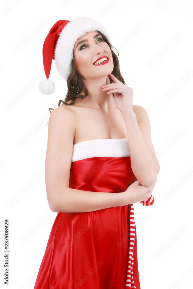 Cute young girl in santa claus costume holding paper shopping bags isolated on white background Cute young girl in santa claus costume holding paper shopping bags isolated on white background