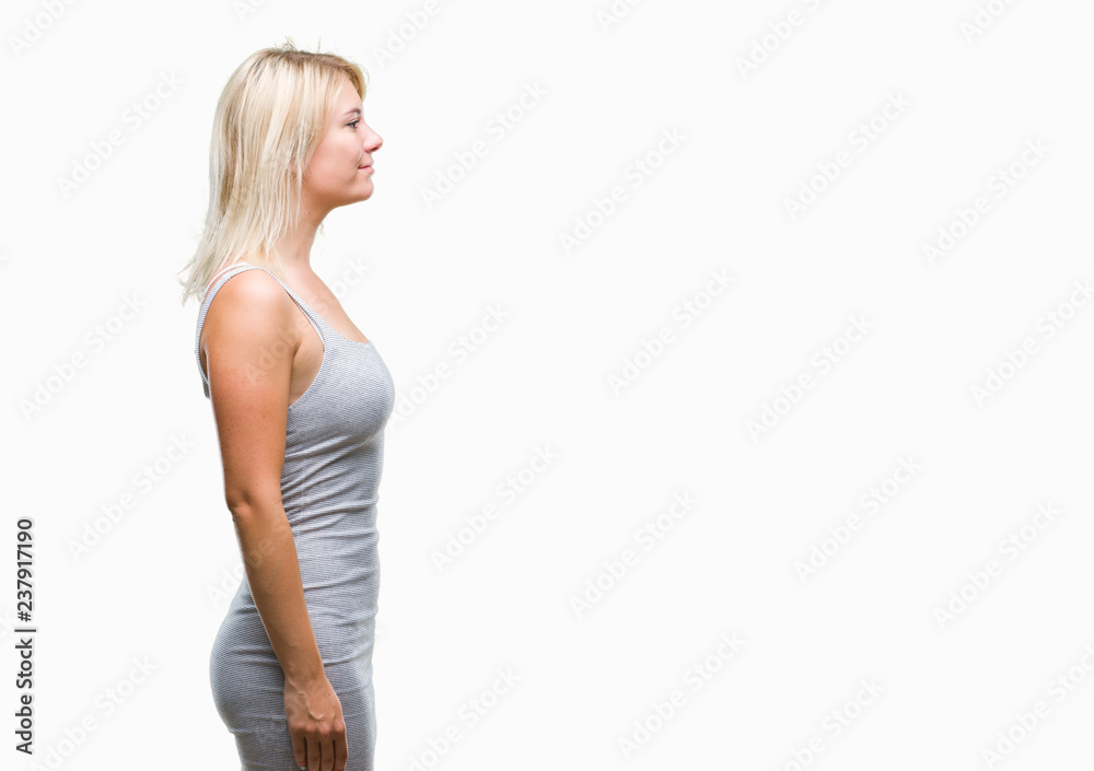 Young beautiful blonde woman over isolated background looking to side, relax profile pose with natural face with confident smile.