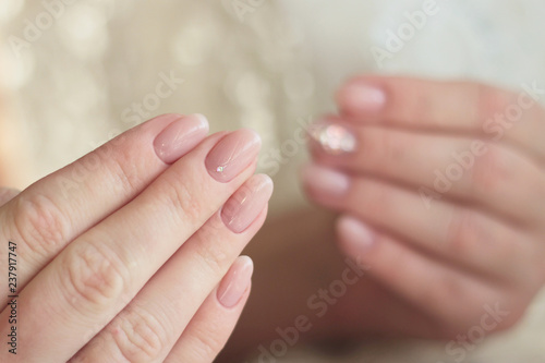 two hands gentle nude pink