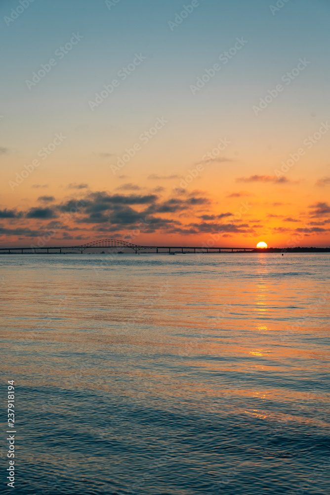 Sunset over the Robert Moses Causeway from Fire Island, New York