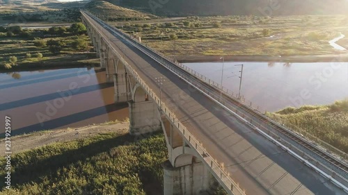 Flight Along Arched Bridge Over River