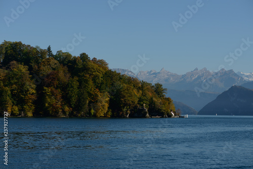 View from the lake on Jesus Christ Statue monument in Meggen, Luzern Lucerne, Switzerland. With background of mountains