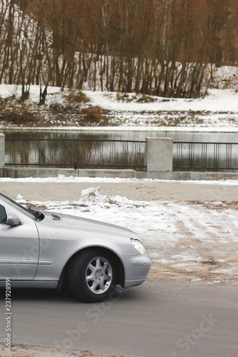 Gray car on the background of the river