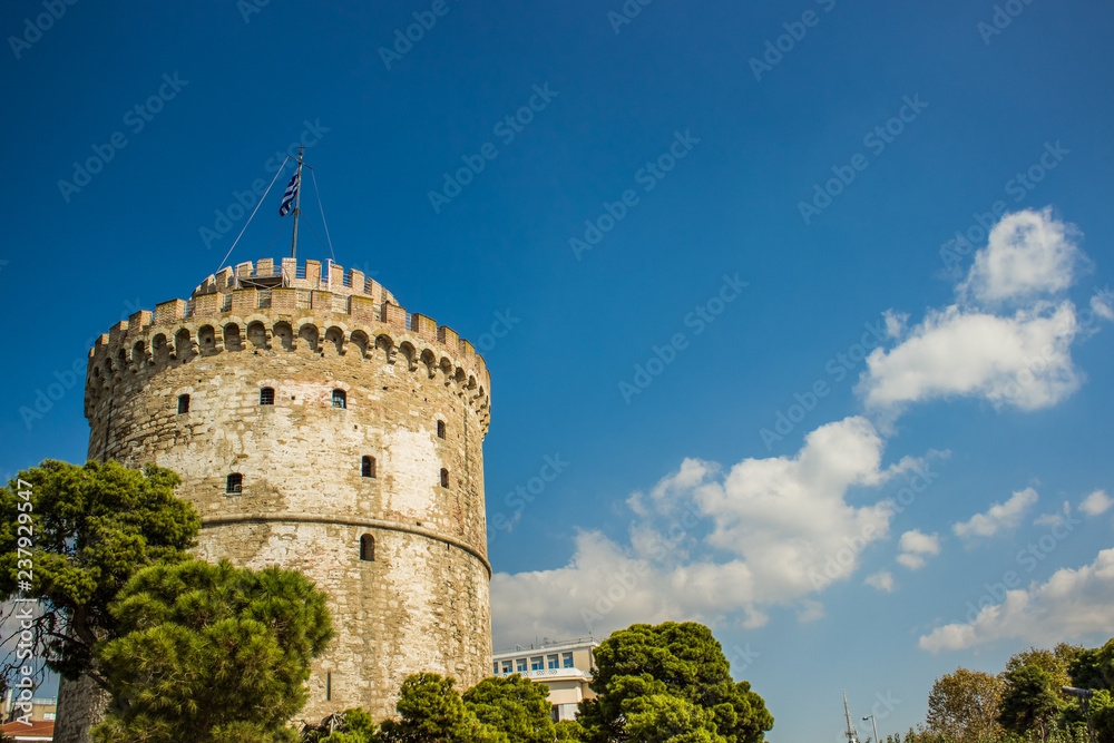 medieval fortress tower building from Byzantine times in Greece in summer clear weather time on vivid blue sky background, tourist concept 