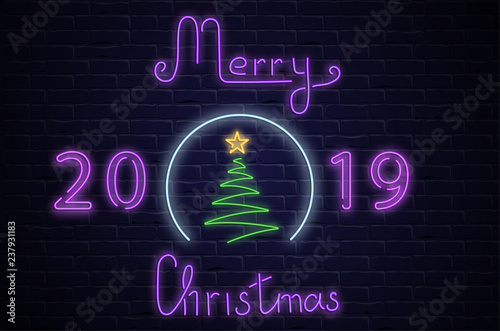 Merry Christmas 2019 neon luminous card with Christmas tree on brick textured background.