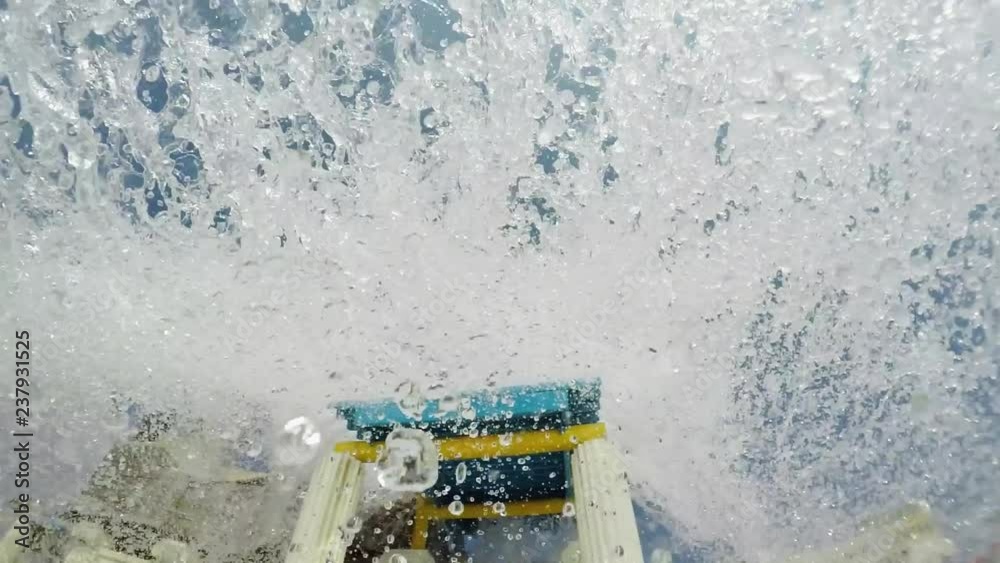 First-person view, water flies to the camera in slow motion.